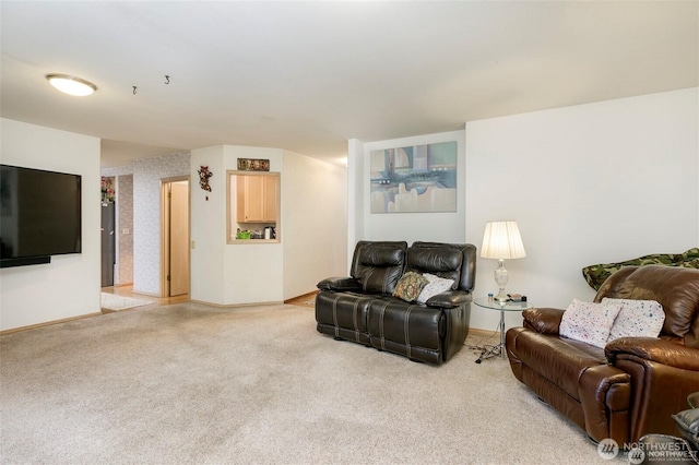 living room featuring light carpet and baseboards
