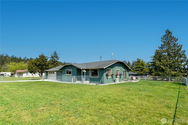 790 N Rhodefer Rd, Sequim, WA 98382 - rear view of property with a lawn, concrete driveway, an attached garage, and a fenced backyard