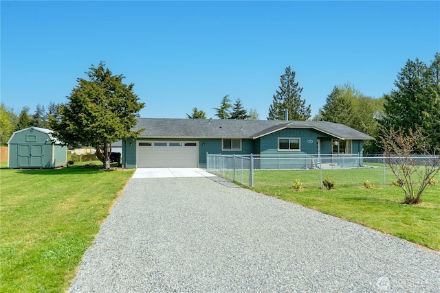 790 N Rhodefer Rd, Sequim, WA 98382 - ranch-style house with a storage unit, gravel driveway, an attached garage, fence, and a front lawn