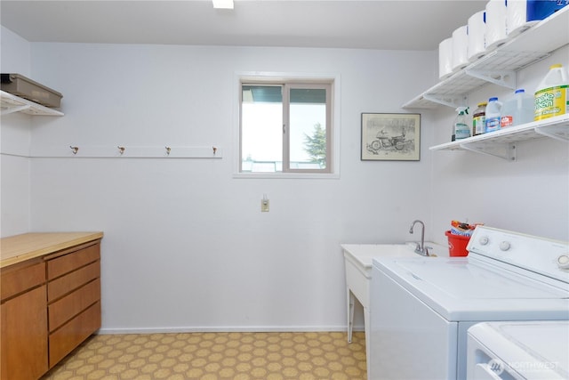 790 N Rhodefer Rd, Sequim, WA 98382 - laundry room with baseboards, washing machine and clothes dryer, laundry area, and light floors