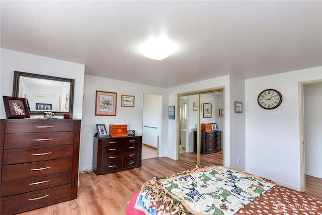 790 N Rhodefer Rd, Sequim, WA 98382 - bedroom with baseboards, light wood-type flooring, and a closet