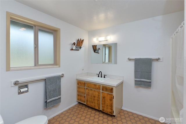 790 N Rhodefer Rd, Sequim, WA 98382 - bathroom featuring tile patterned floors, toilet, vanity, and baseboards