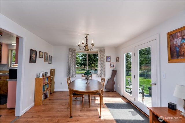 790 N Rhodefer Rd, Sequim, WA 98382 - dining space featuring a wealth of natural light, a chandelier, light wood-type flooring, and baseboards