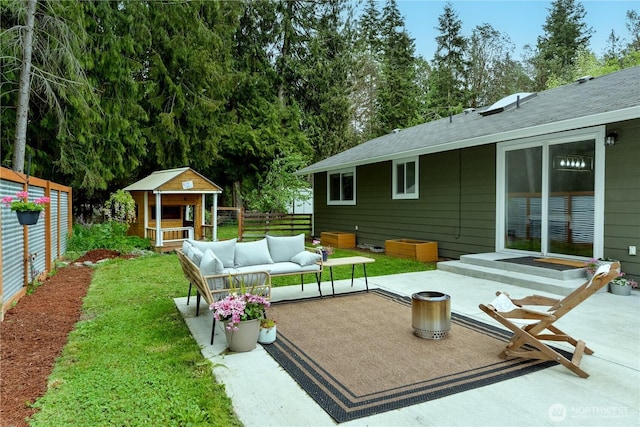 exterior space with an outdoor living space and fence