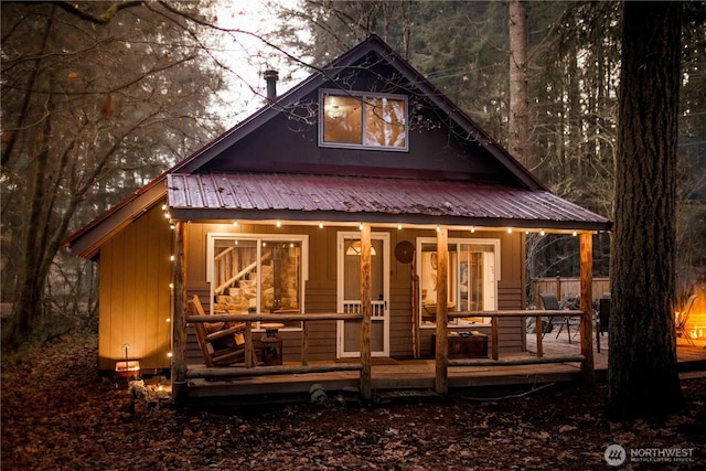 139 Mount Rainier Dr, Packwood, WA 98361 - back of house featuring metal roof and covered porch