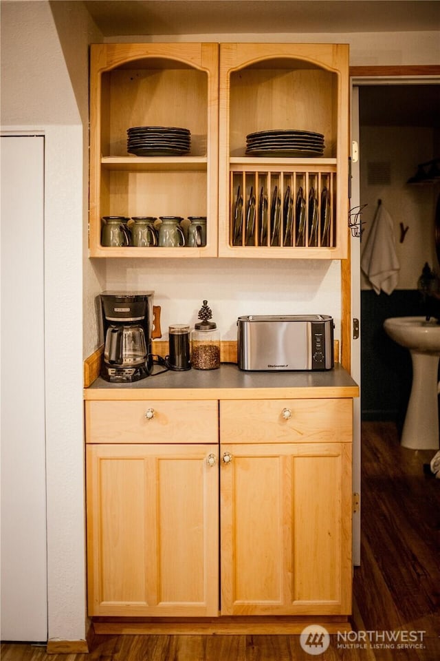 139 Mount Rainier Dr, Packwood, WA 98361 - kitchen with light brown cabinetry, open shelves, a sink, dark countertops, and dark wood-style floors