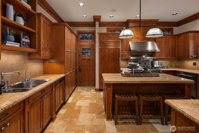 137 Lake Ave W, Kirkland, WA 98033 - kitchen with under cabinet range hood, brown cabinets, a sink, and decorative backsplash