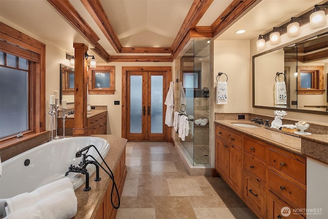 137 Lake Ave W, Kirkland, WA 98033 - bathroom with two vanities, a bath, a sink, a stall shower, and french doors