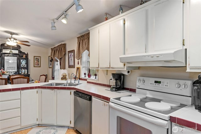 kitchen with electric range, stainless steel dishwasher, a sink, tile counters, and under cabinet range hood