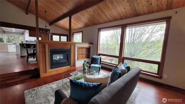 2205 135th Pl SE, Bellevue, WA 98005 - living area with a glass covered fireplace, wood finished floors, baseboards, and wooden ceiling
