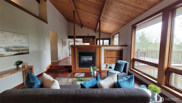 2205 135th Pl SE, Bellevue, WA 98005 - living area featuring wood finished floors, wooden ceiling, beam ceiling, a glass covered fireplace, and baseboards