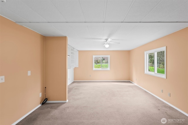 24709 148th Ave E, Graham, WA 98338 - spare room featuring carpet flooring, a ceiling fan, and baseboards