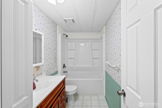 24709 148th Ave E, Graham, WA 98338 - bathroom with wallpapered walls, a textured ceiling, vanity, toilet, and shower / bathtub combination