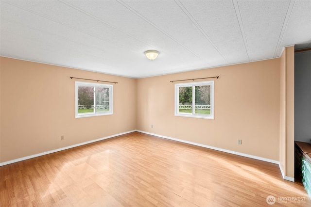 24709 148th Ave E, Graham, WA 98338 - empty room with light wood-style floors and baseboards
