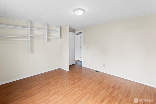 24709 148th Ave E, Graham, WA 98338 - unfurnished room featuring light wood-style floors and baseboards