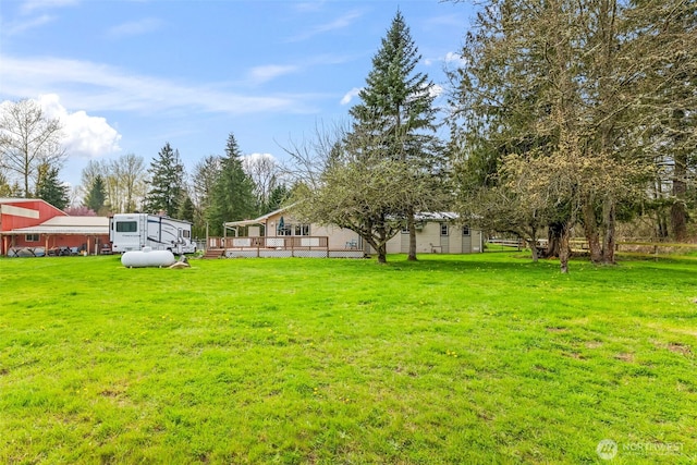 24709 148th Ave E, Graham, WA 98338 - view of green lawn with a deck