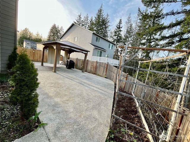 view of patio featuring a gazebo and a fenced backyard