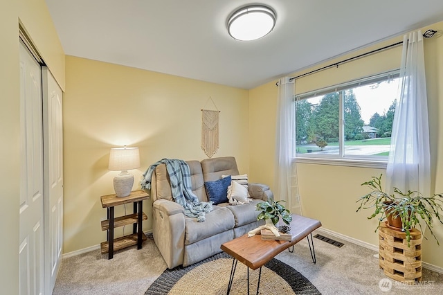 5786 Skagit Pl, Blaine, WA 98230 - living area featuring light colored carpet, baseboards, and visible vents