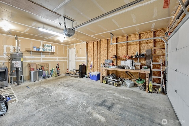 5786 Skagit Pl, Blaine, WA 98230 - garage featuring secured water heater, a garage door opener, and a workshop area