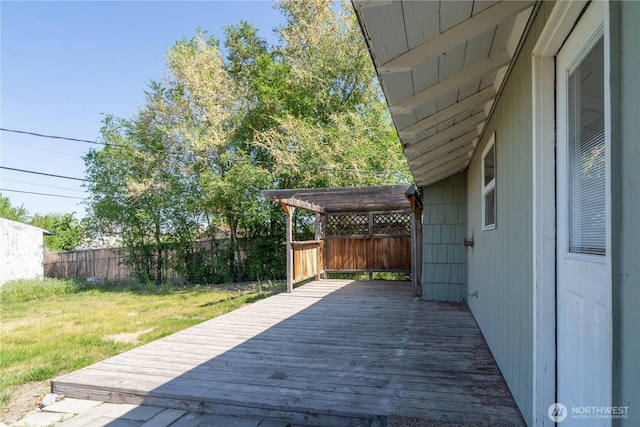 wooden terrace with a yard, a pergola, and a fenced backyard