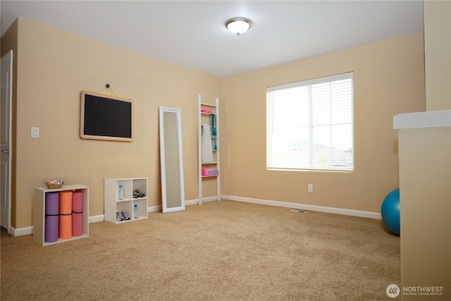 recreation room with baseboards, carpet flooring, and visible vents