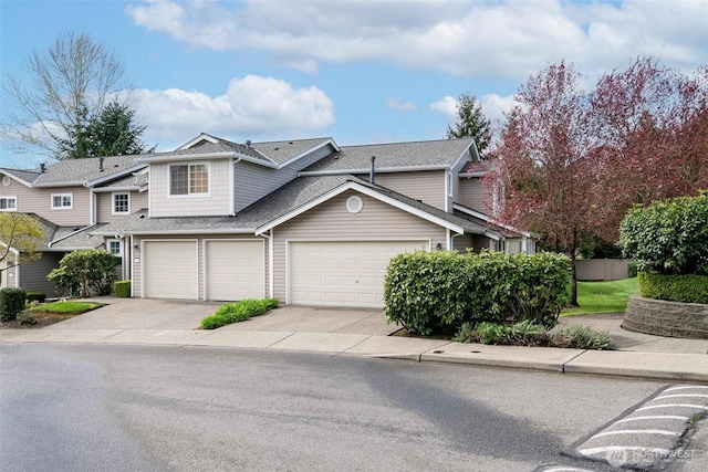 4802 Nassau Ave NE Unit 45, Tacoma, WA 98422 - view of front of property featuring roof with shingles, driveway, and an attached garage