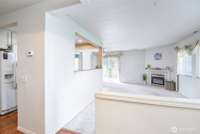 4802 Nassau Ave NE Unit 45, Tacoma, WA 98422 - interior space with visible vents, white refrigerator with ice dispenser, a ceiling fan, and a fireplace
