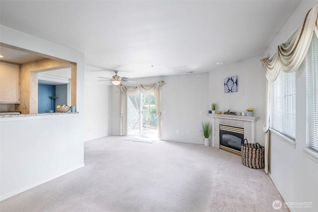 4802 Nassau Ave NE Unit 45, Tacoma, WA 98422 - living room with a ceiling fan, carpet, and a tile fireplace