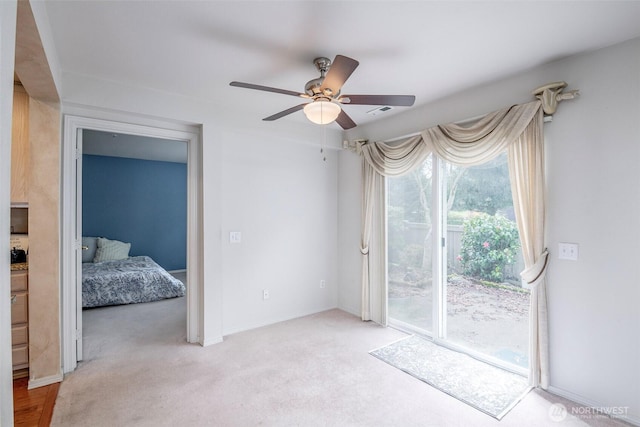 4802 Nassau Ave NE Unit 45, Tacoma, WA 98422 - empty room with light carpet and ceiling fan