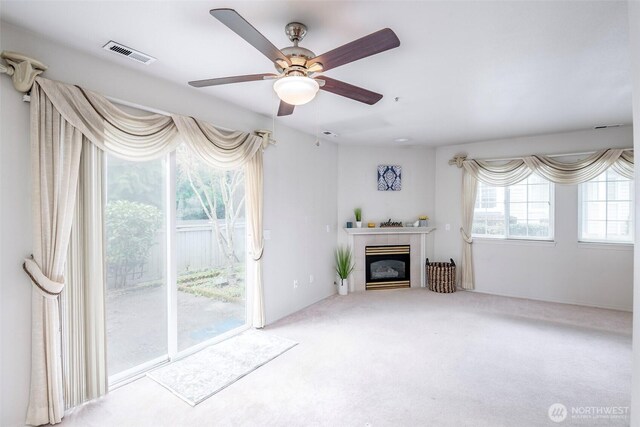 4802 Nassau Ave NE Unit 45, Tacoma, WA 98422 - unfurnished living room with a fireplace, carpet, visible vents, and ceiling fan