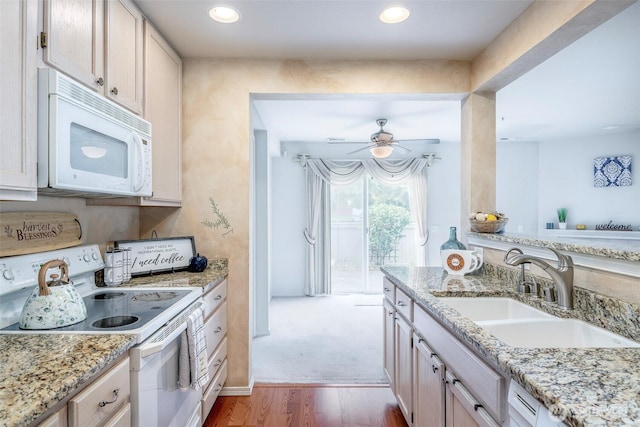 4802 Nassau Ave NE Unit 45, Tacoma, WA 98422 - kitchen featuring ceiling fan, white appliances, light stone countertops, wood finished floors, and a sink