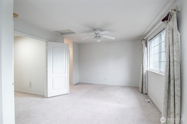 4802 Nassau Ave NE Unit 45, Tacoma, WA 98422 - spare room featuring carpet flooring, visible vents, attic access, and ceiling fan