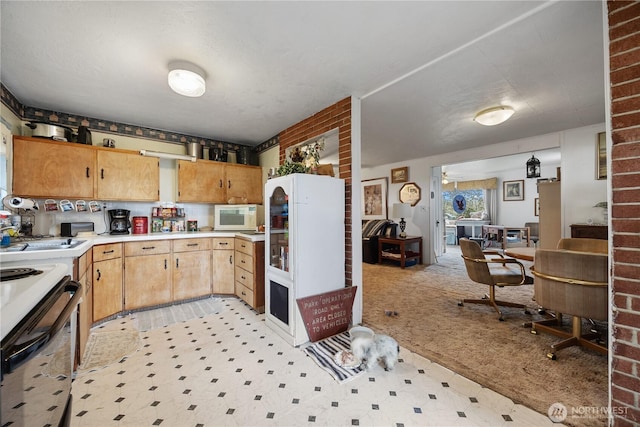 kitchen with light carpet, white appliances, light countertops, and a sink