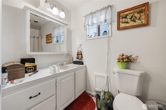 full bathroom featuring toilet and vanity