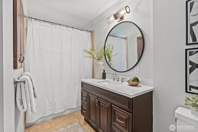bathroom featuring toilet, ornamental molding, vanity, and a shower with shower curtain