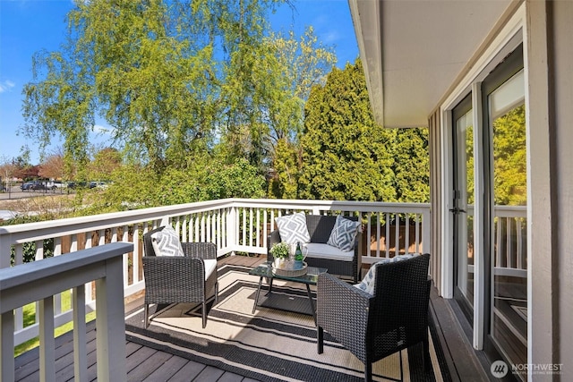 wooden deck featuring outdoor lounge area