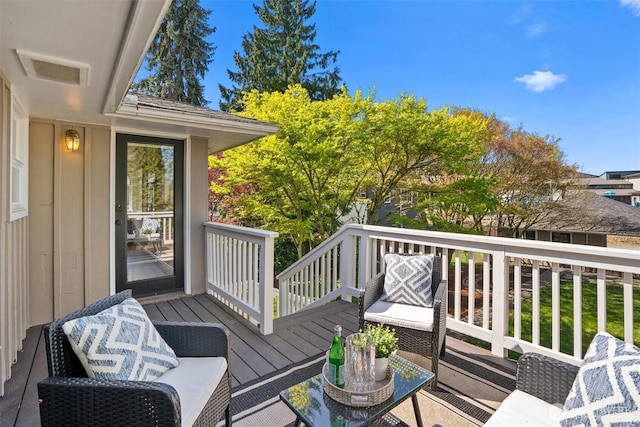 wooden deck with visible vents
