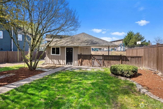 view of outdoor structure with a fenced backyard and an outdoor structure