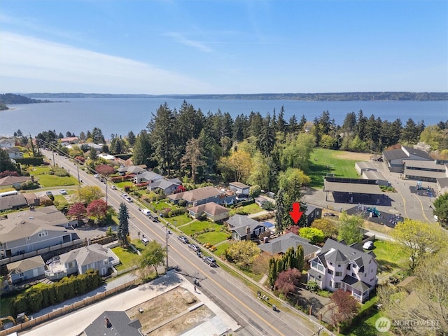 bird's eye view with a residential view and a water view