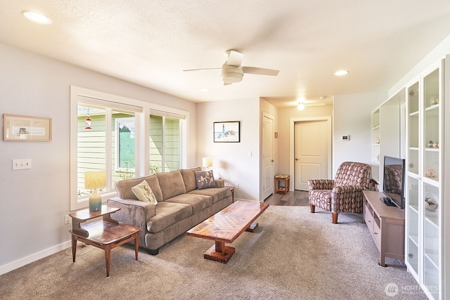 living area with recessed lighting, carpet flooring, baseboards, and a ceiling fan