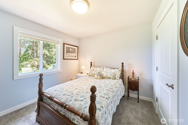 carpeted bedroom featuring baseboards