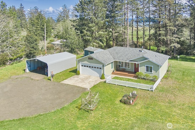 view of front of property with a porch, roof with shingles, a front yard, and concrete driveway