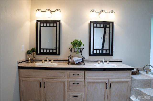 full bath featuring a sink and double vanity