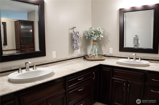 bathroom with double vanity and a sink