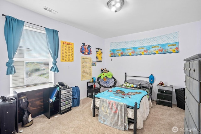 bedroom featuring carpet floors, visible vents, and multiple windows