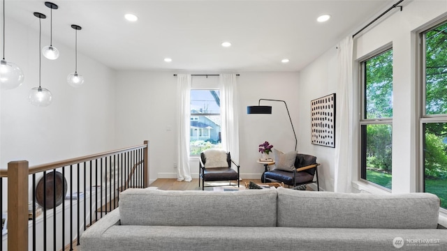 living room featuring recessed lighting, baseboards, and wood finished floors