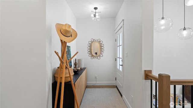 interior space with light wood-style floors and baseboards