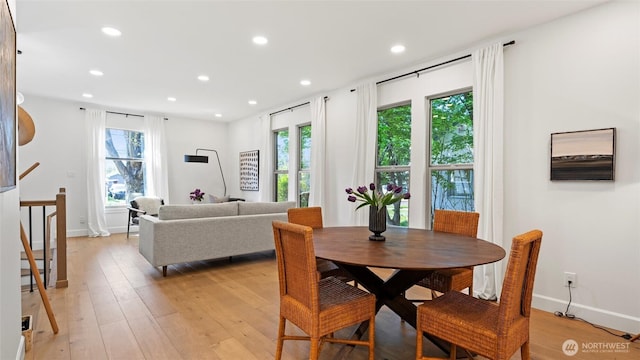 dining room featuring recessed lighting, baseboards, and light wood-type flooring