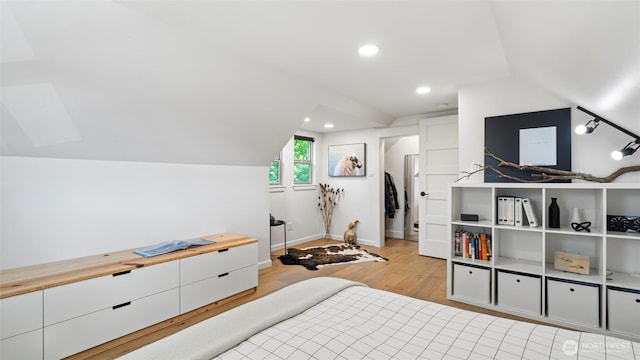 bedroom with recessed lighting, baseboards, vaulted ceiling, and light wood finished floors