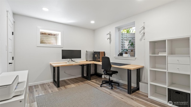 office featuring recessed lighting, baseboards, and light wood-style flooring
